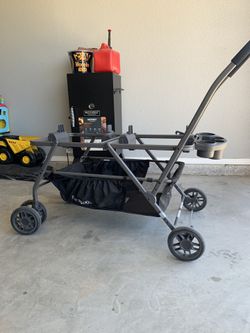Joovy twin stroller with Graco car seat adapters