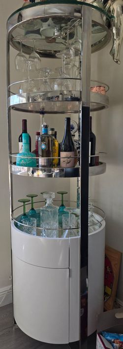 🟢 TITLE
Modern Bar Cabinet with Glass Shelves – Chrome & White Finish.