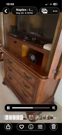 This is a Shenandoah Valley Charleston Wall Entertainment Unit, featuring a traditional style with a brown wood finish.