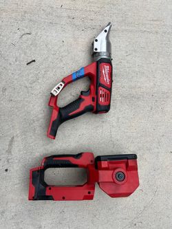 Milwaukee double cut shear 18v like new asking $200 and Milwaukee led light 18v $90