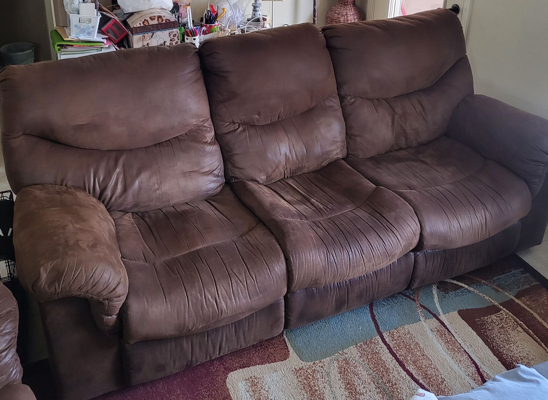 Brown sofa with two recliners