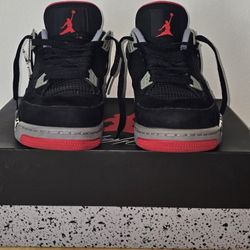 Pair of used Air Jordan 4 retro black cement grey fire red [Damaged]
