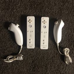 2 Nintendo WII Remotes and 2 Nunchuk Controllers