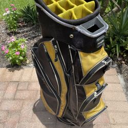 Powerbilt golf cart bag with 14 club dividers and shoulder strap . 