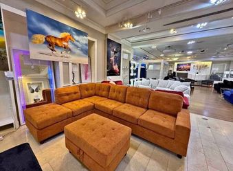 Rust Fabric Reversible Sectional with Cup Holder and Storage Ottoman. Brand New.
