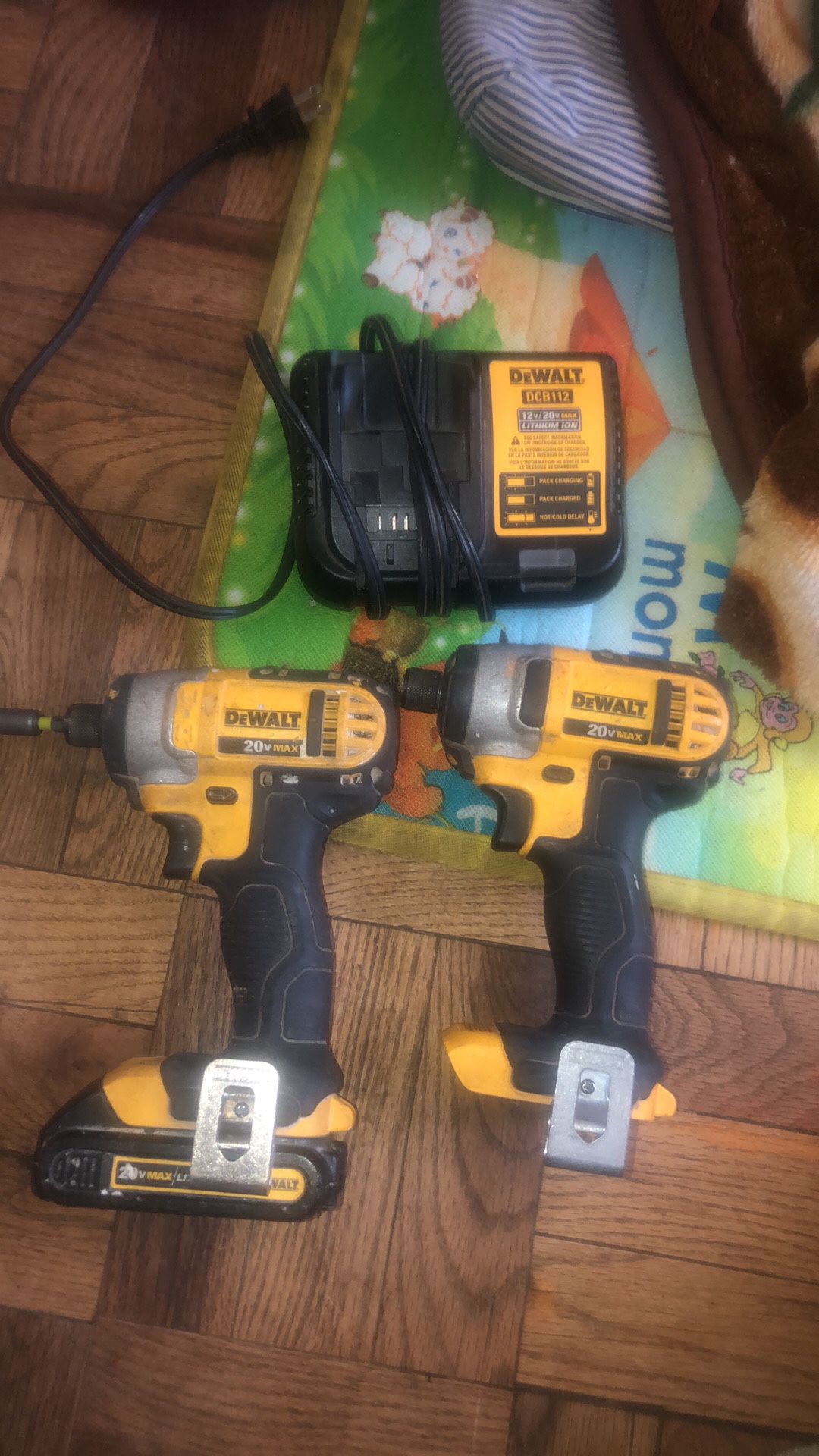 Two drill with one battery in charger