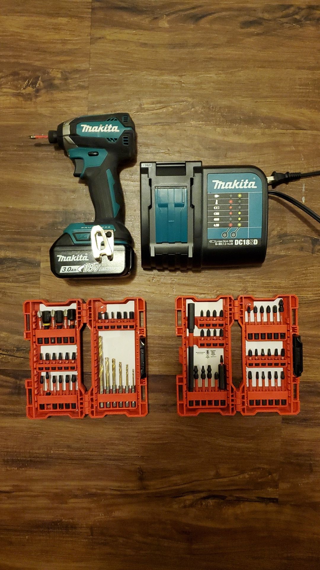 Makita 3.0ah 18 v lithium ion Impact driver. / Milwaukee Drill bit sets... Everything is just about new .....[$110 whole lot...]