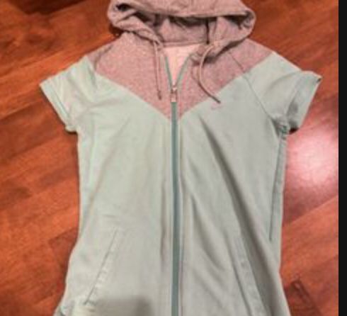 Woman’s Nike short sleeve, zipper jacket size small shipping available