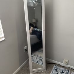 White 360 degree rotating jewelry cabinet with full length mirror