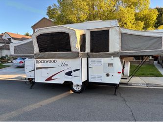 2007 rock wood pop up 16 ft with slide sleeps 6