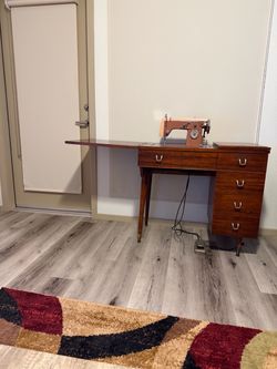 Sewing machine and table