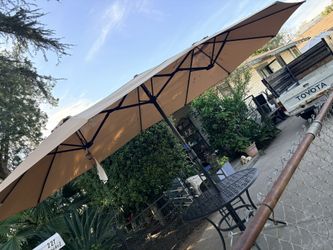 Three Piece Umbrella, One Table 4 Chairs
