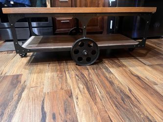 Industrial Style Coffee Table on wheels/ Ashley furniture
