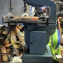 Woodworking Bandsaw 14" JWBS-14The image shows a JET JWBS-14CS 14-inch Closed Stand Bandsaw. 
Here's some information about this bandsaw:
Features:
It