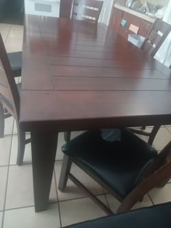 6 chairs dining table,as you can see 2 chairs have a ripped one more that the other one,but good fair condition,