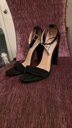 This is a pair of Steve Madden Carrson black suede block-heel sandals
