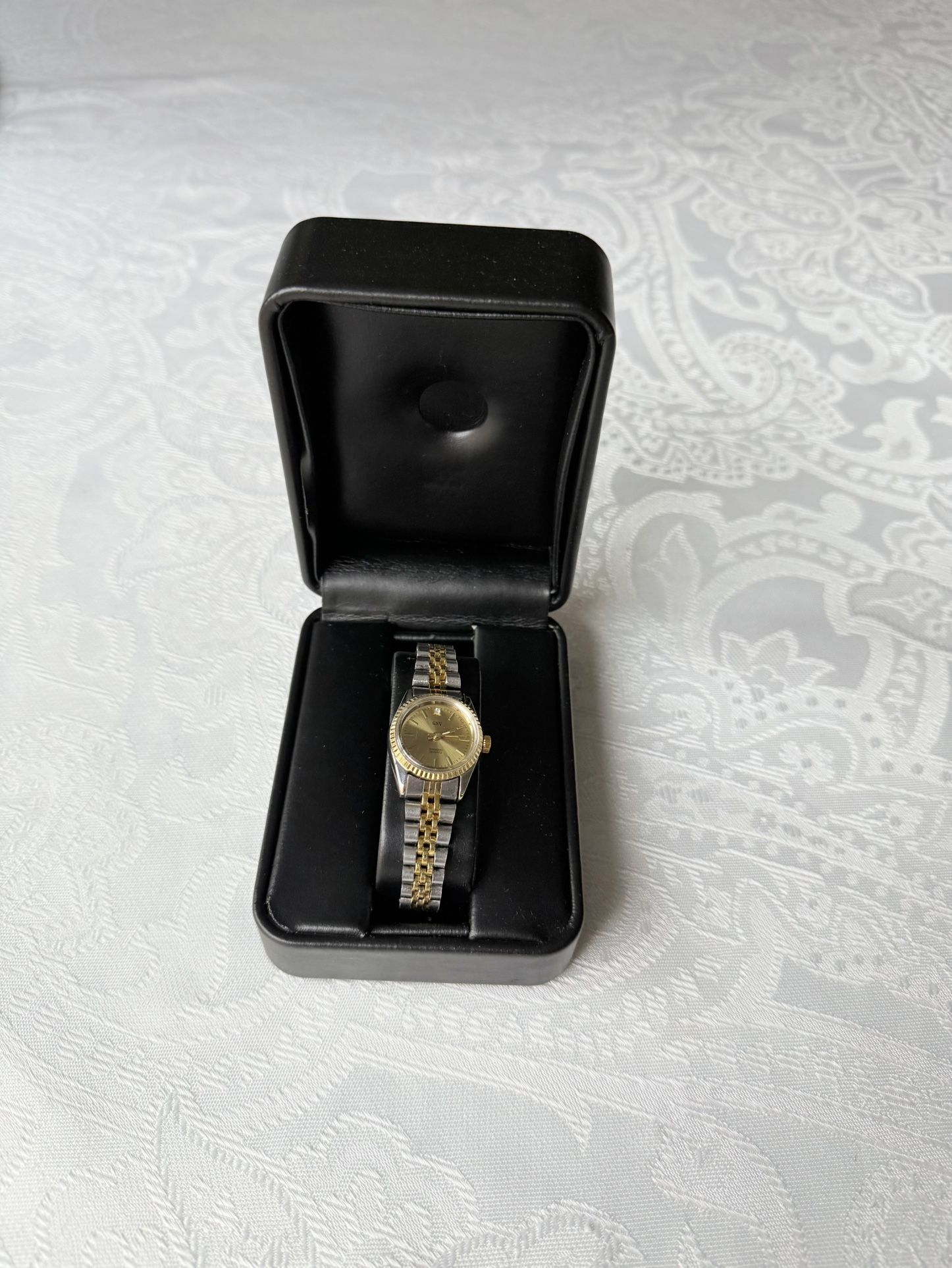 GENEVA Ladies Two Toned Diamond Quartz Watch. Perfect accessory for any woman. With a beautiful gold and silver band color, this watch is both casual