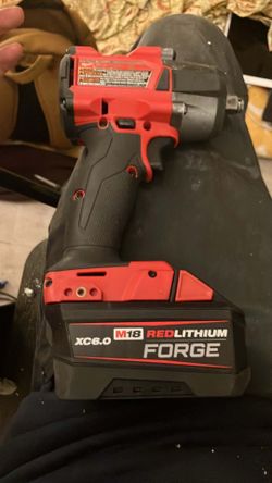Milwaukee mid torque half inch drive impact wrench w/ friction ring and m18 Xc6.0 Red Lithium Forge Battery