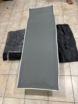 Portable camping cot with cushion