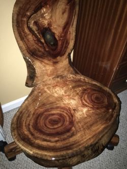 Camphor wood rolling chair With a piece of agate rock