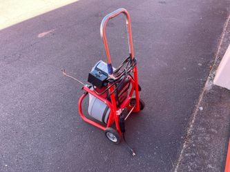 Rigid drain snake with Auger