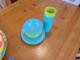 Plastic plates, bowls and cups.