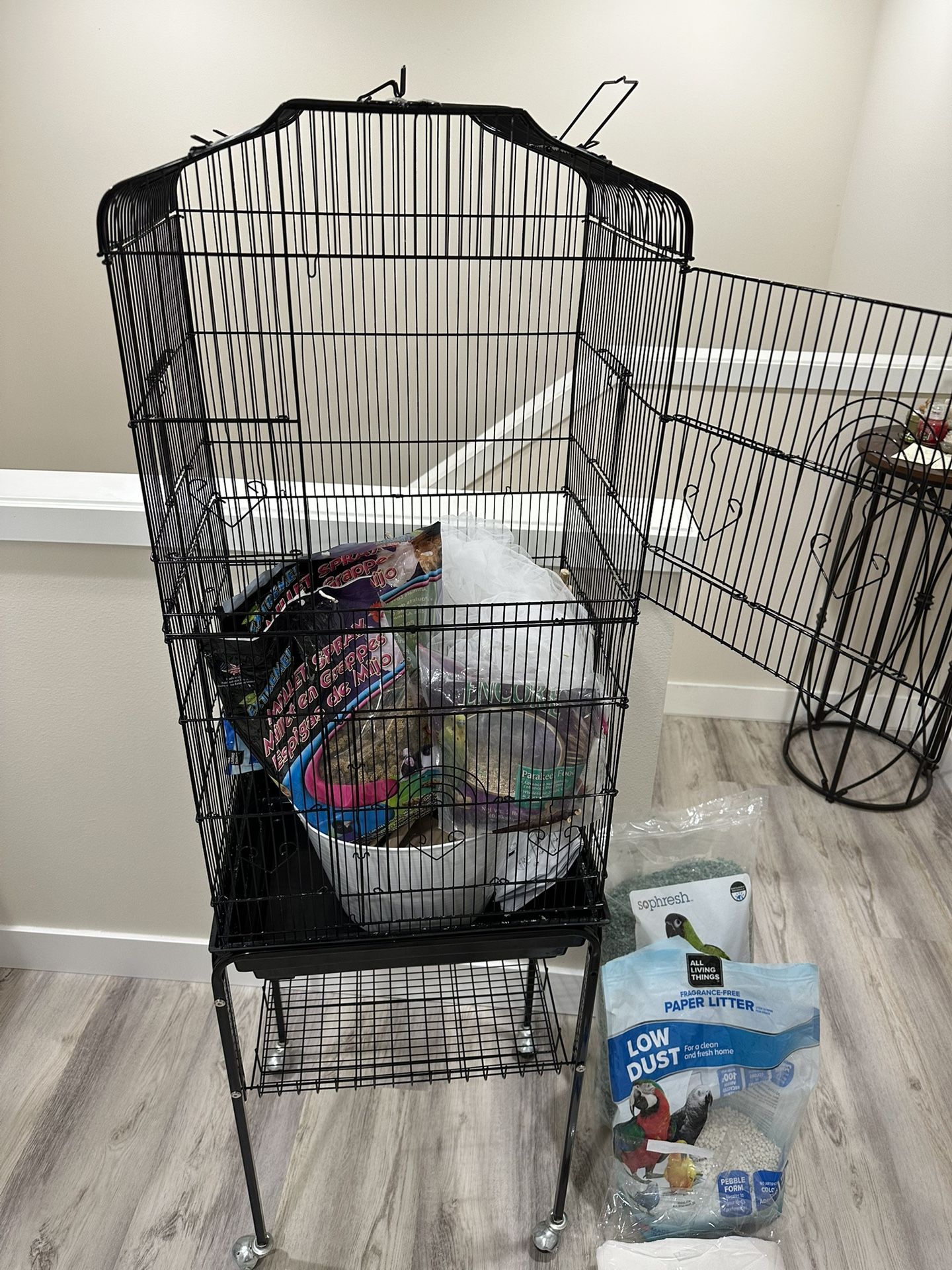 Bird Cage with everything you need. Only thing missing is the bird.