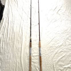 2 vintage great condition 6.6 Ft One Piece Fishing Rods. One Is a Berkley & Other Is J. C. Higgins 