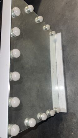 Vanity mirror with ambient lighting