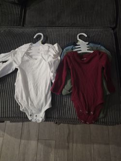 Carter's brand long-sleeve  bodysuits in a 3-month size