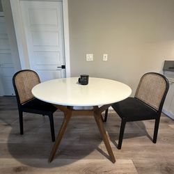 Round Table and Rattan Chairs