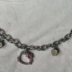 2008 Sanrio Hello Kitty Charm Bracelet. The left whisker is missing a gem. Not used but was stored for a long time. 