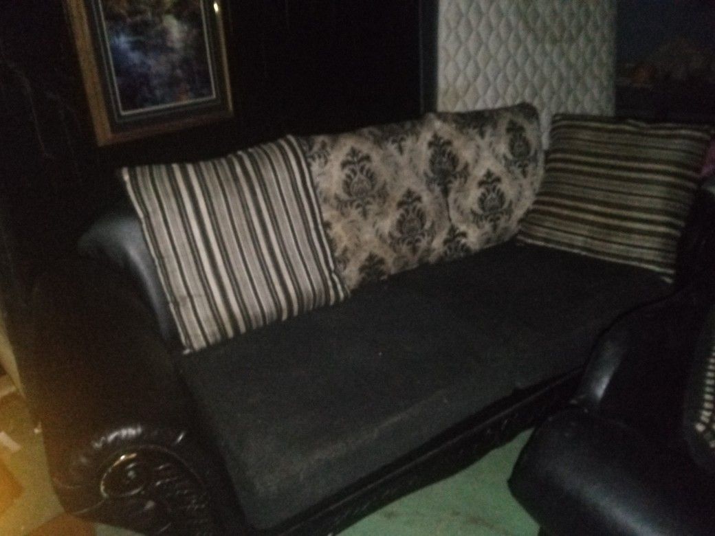 Two Piece Black Leather And Material Couch Set