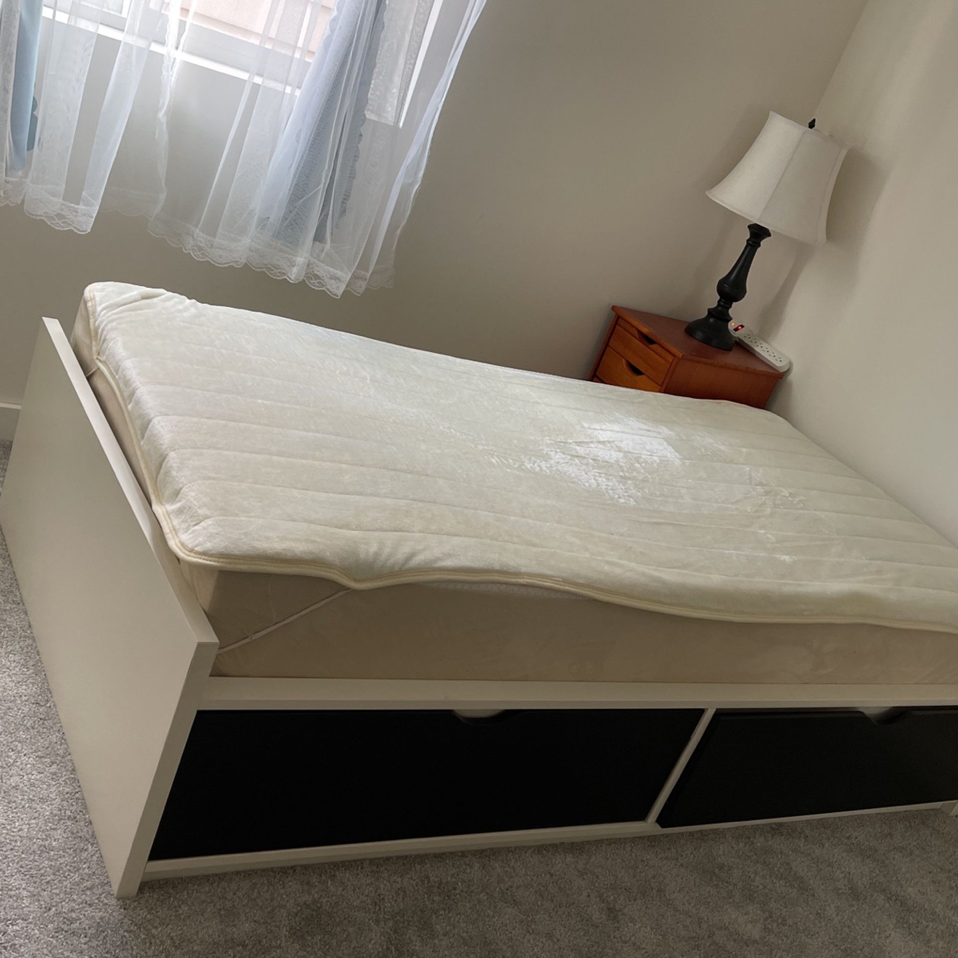 Ikea twin bed with outlet black drawers