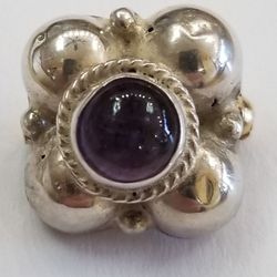 Silver Pin Set With A Cabochon Amethyst 