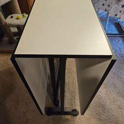 Foldable material cutting table- white formica top.