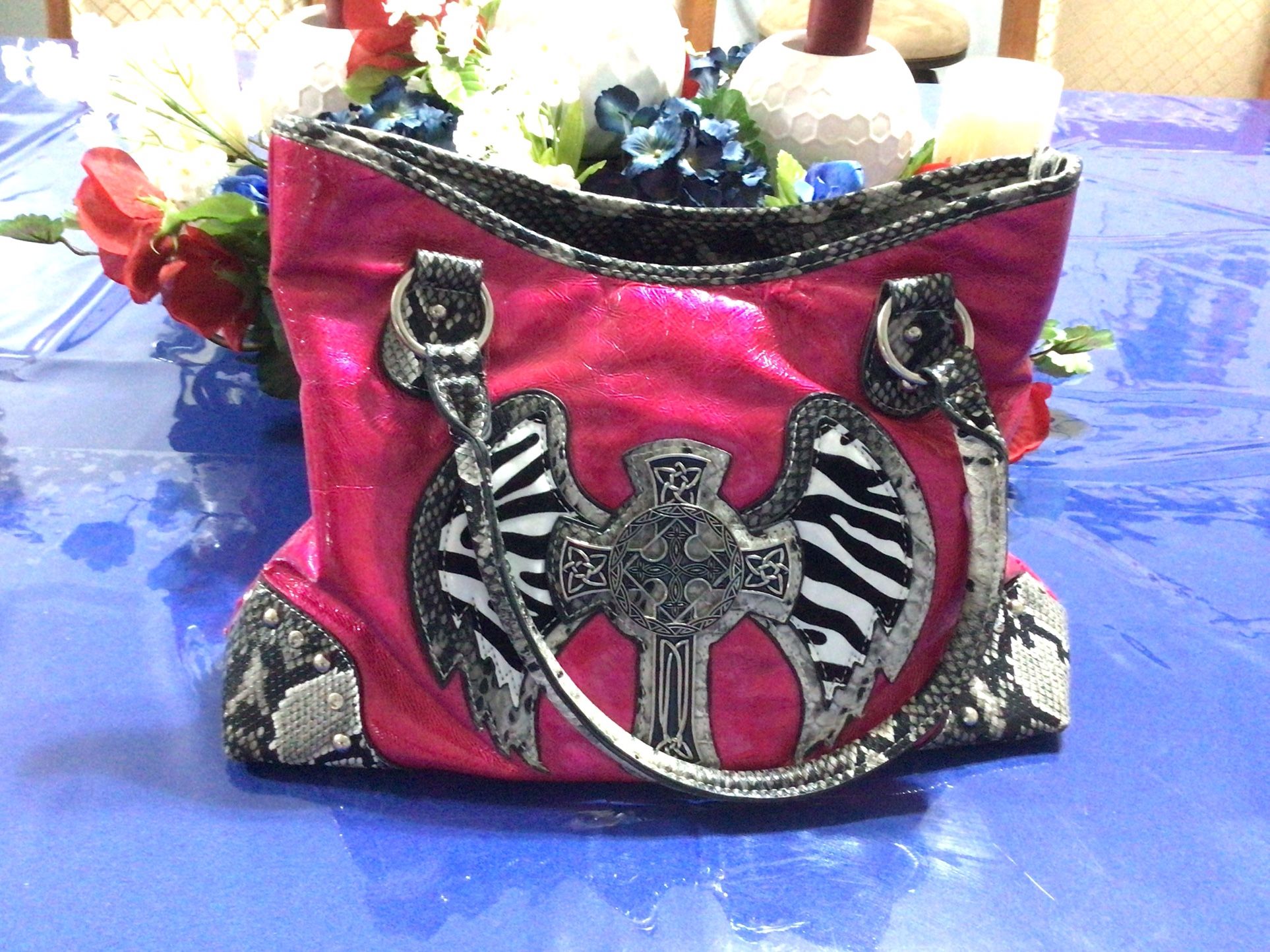 Pink Purse Gently Used. Lots of Pockets. Also Has A Gun Pocket In Back