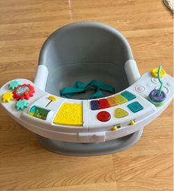 Infantino booster seat with interactive toys