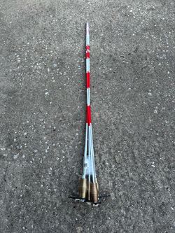Red and White Surveying Range Poles with Base