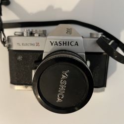 Yashica TL Electro-X 35mm SLR film camera with Lenmark RX7 52mm lenses with cases