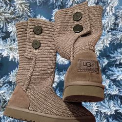 These are the UGG Classic Cardy boots. This popular style combines the coziness of a sweater with the comfort of UGG's classic boots. 