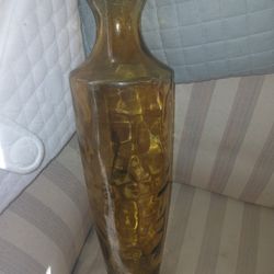 VINTAGE AMBER GLASS VASE. 17 3/4" TALL BY 3 1/2" ACROSS 