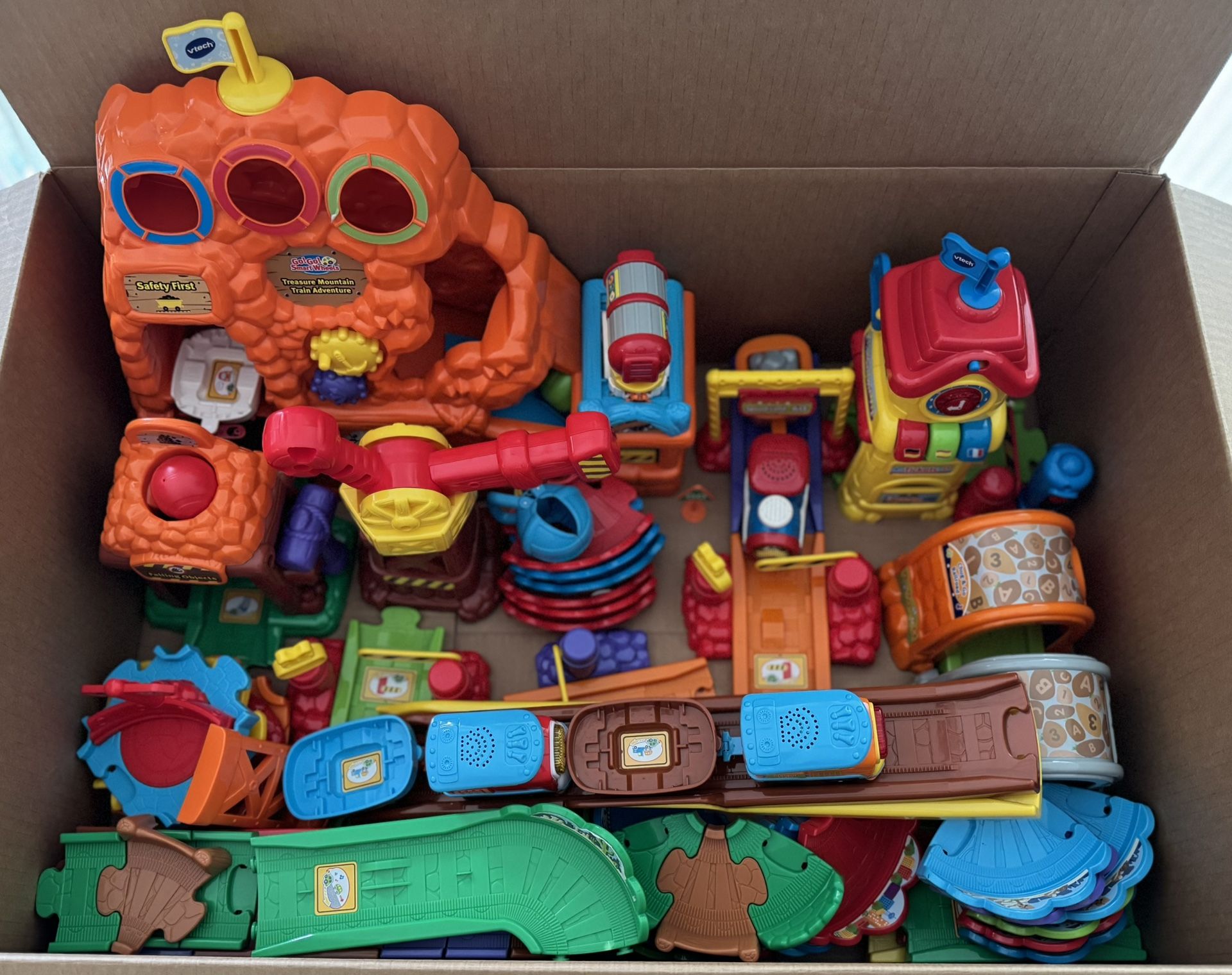 Train Sets•V Tech Go Go Smart Wheels Treasure Mountain Train Adventure & Chug & Go Train Set• 3 Trains With 5 Cabooses• Batteries Included