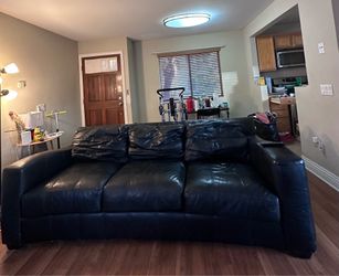 For free! Black leather sofa...