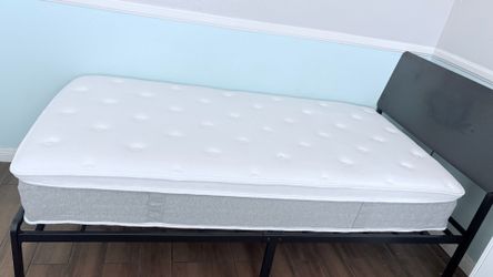 Twin Size bed frame and mattress.