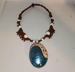 Disney Moana "Magical Light-Up Seashell Necklace" toy.