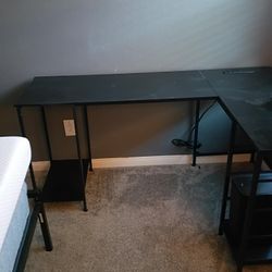 black laminate computer table with inserted plugins