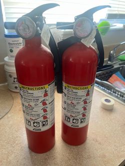 Two Kidde ABC fire extinguishers
