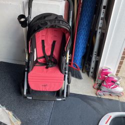 Stroller Evenflo Foldable Pink Shows It Folded