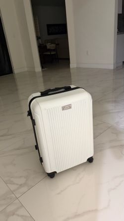 white small luggage